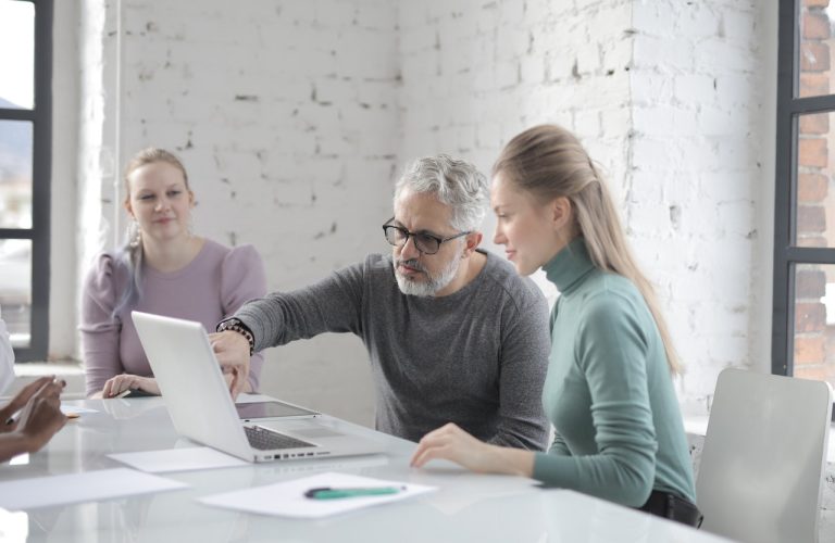colleagues working together on a laptop